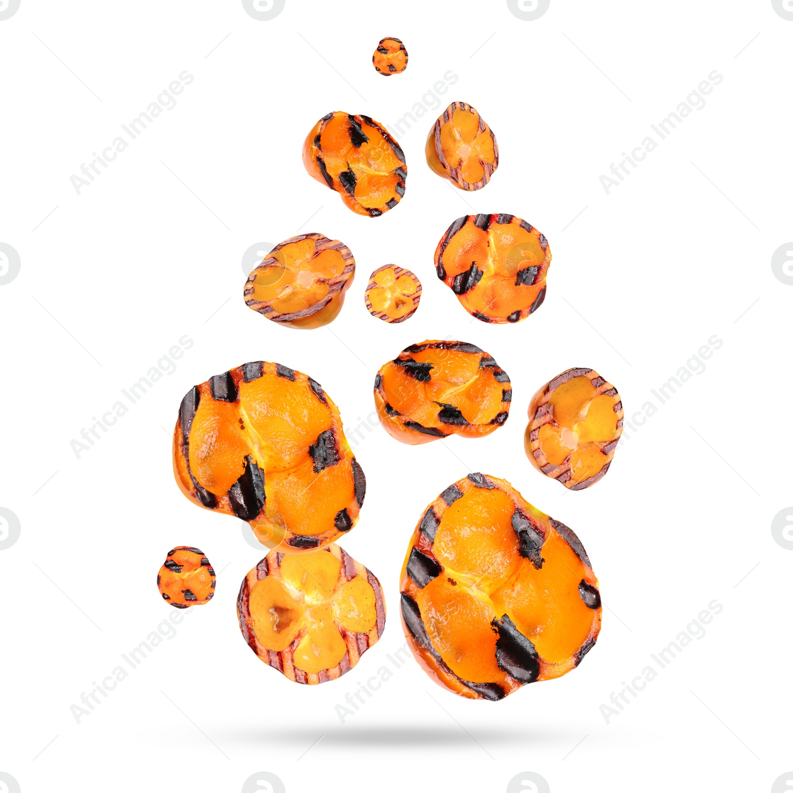 Image of Slices of grilled bell peppers in air on white background