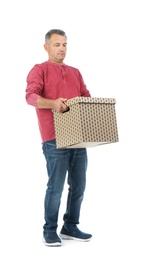 Photo of Full length portrait of mature man carrying carton box on white background. Posture concept