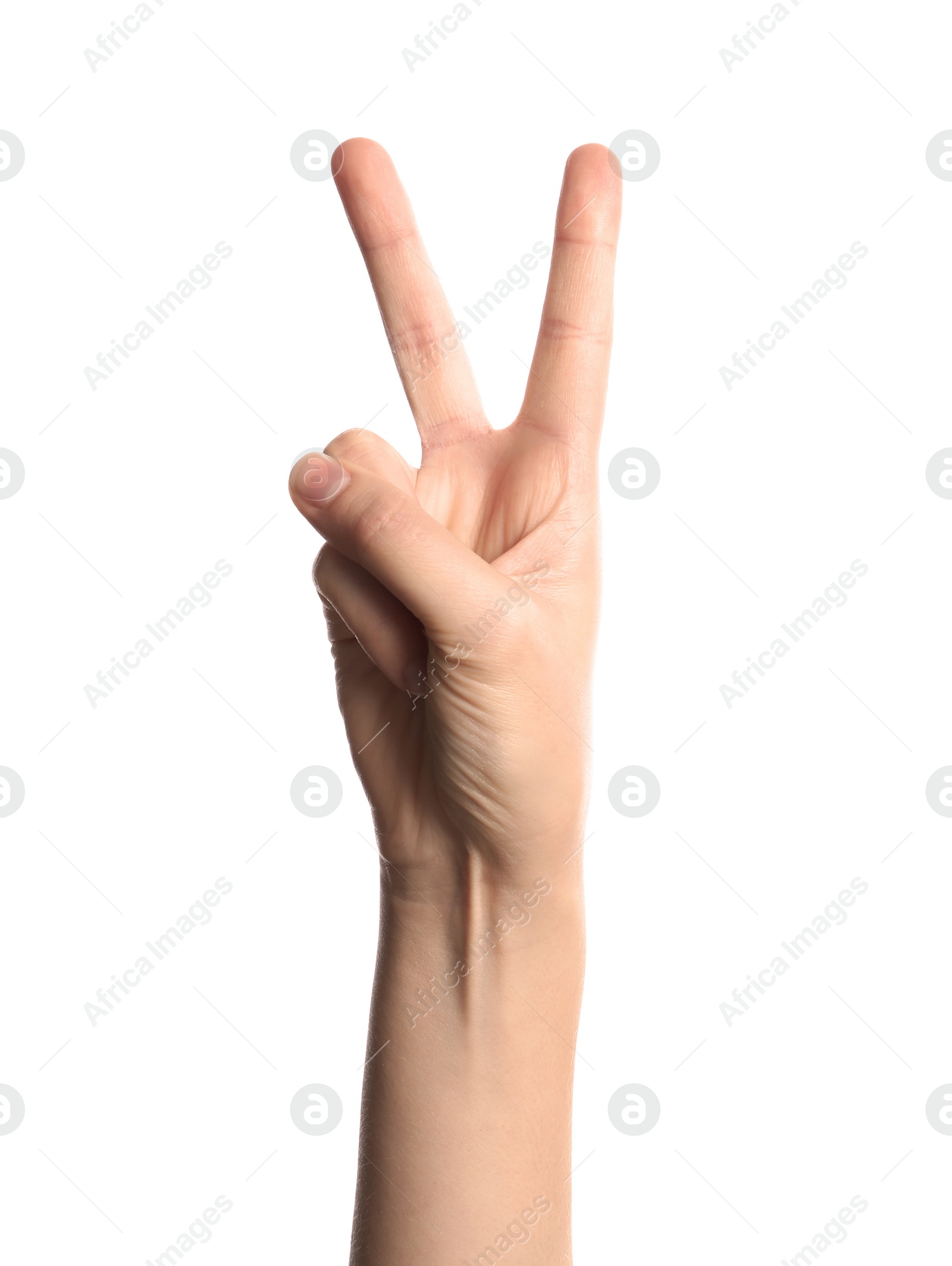 Photo of Young woman showing victory gesture on white background