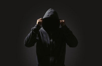 Photo of Silhouette of anonymous man on black background
