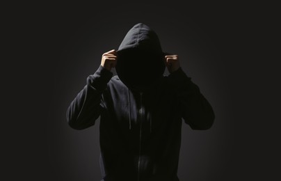 Silhouette of anonymous man on black background