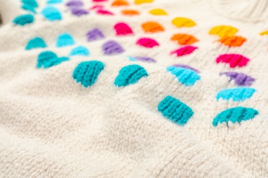 Photo of Texture of cozy warm sweater as background, closeup