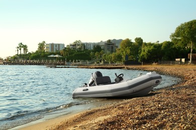 Photo of Beautiful view of resort and moored boat on seashore