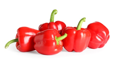 Photo of Tasty ripe red bell peppers on white background