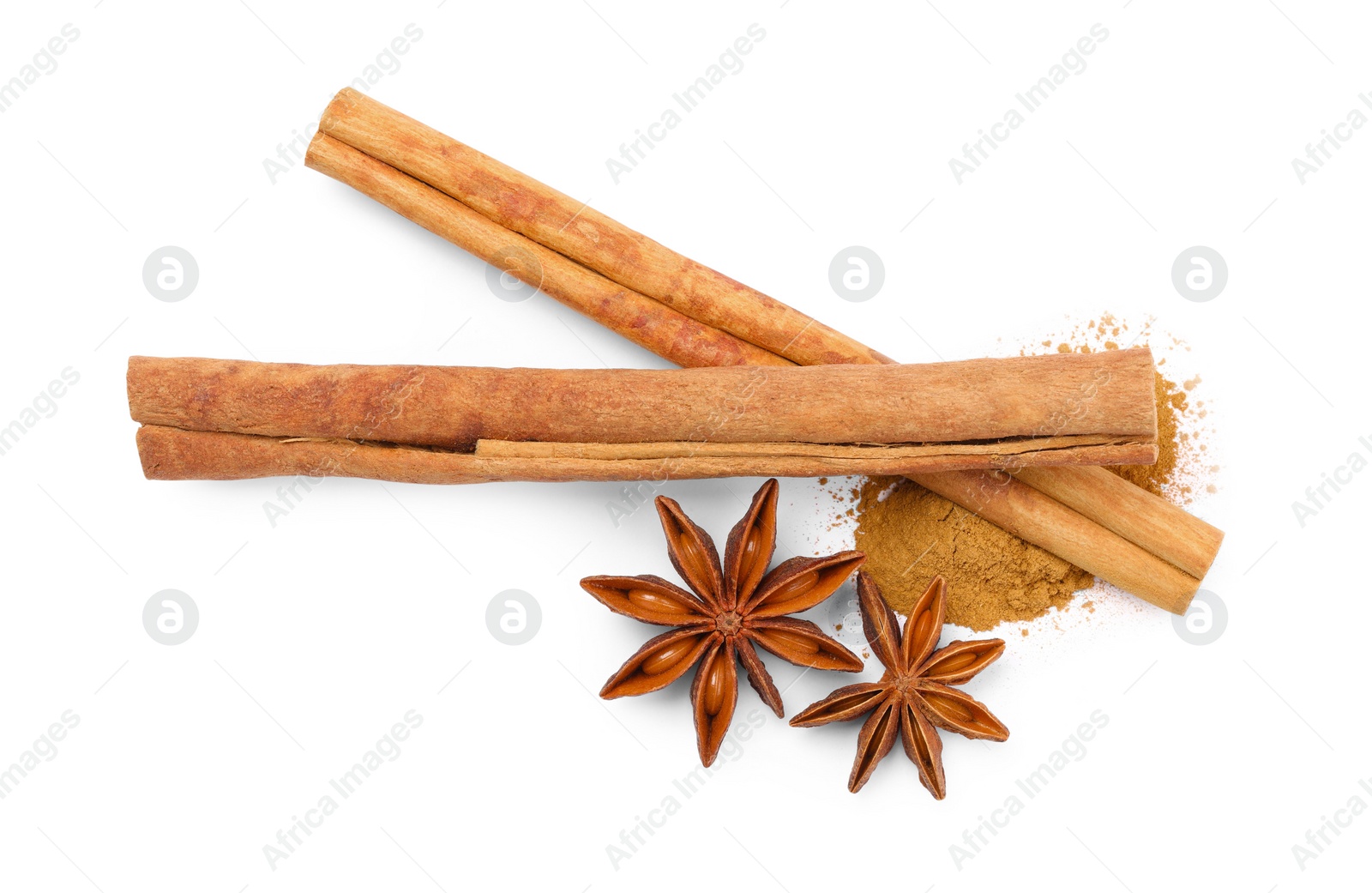 Photo of Dry aromatic cinnamon sticks, powder and anise stars isolated on white, top view