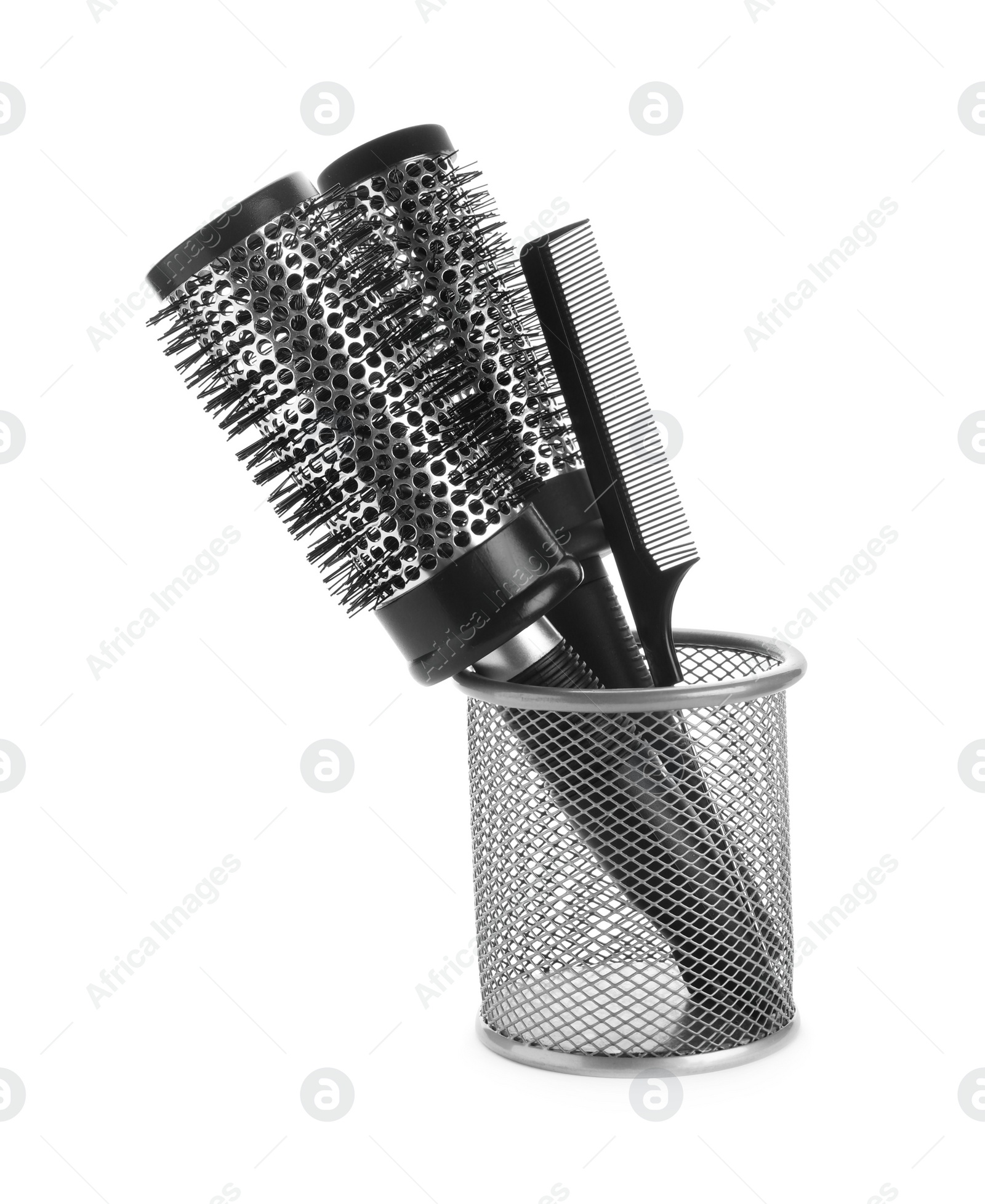 Photo of New modern hair brushes and comb in metal holder isolated on white