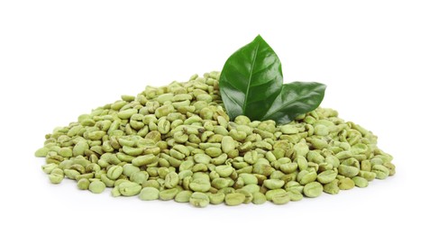 Green coffee beans and fresh leaves on white background