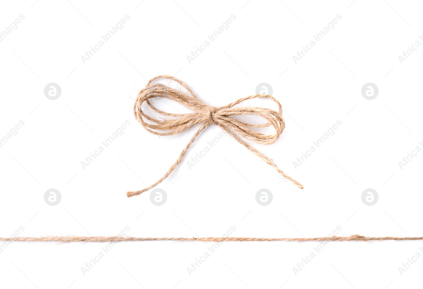 Photo of Linen rope string with bow isolated on white, top view