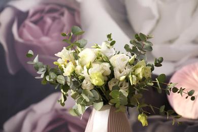 Beautiful bouquet of flowers on table in room. Stylish interior design