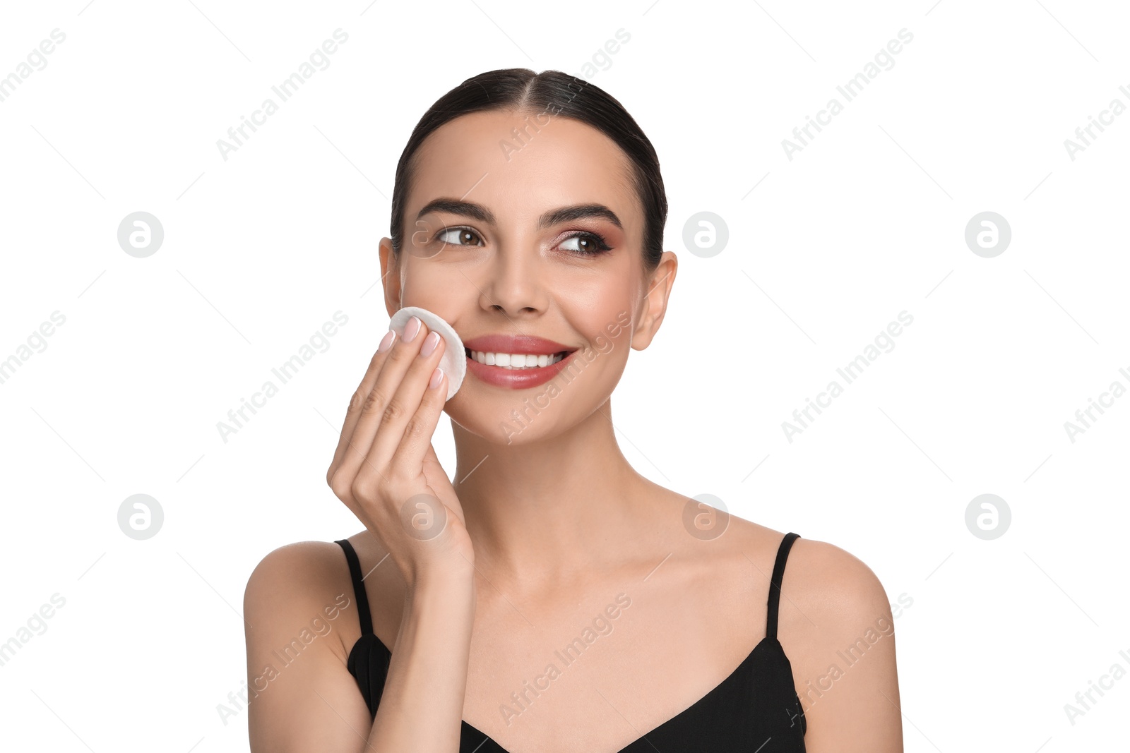 Photo of Beautiful woman removing makeup with cotton pad on white background