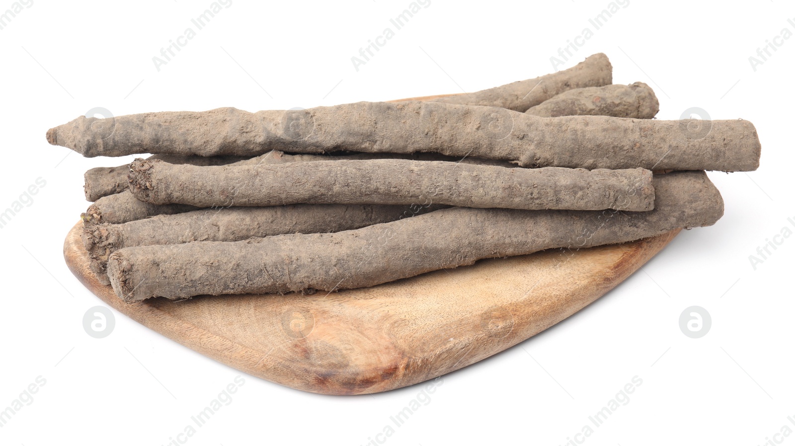 Photo of Wooden board with raw salsify roots on white background