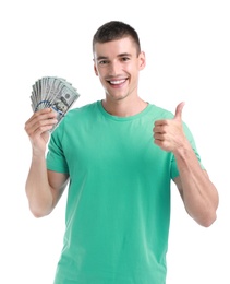 Handsome young man with dollars on white background