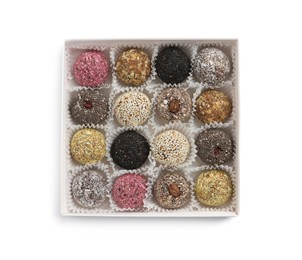 Photo of Different delicious vegan candy balls in box on white background, top view