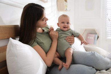 Mother with her cute baby at home