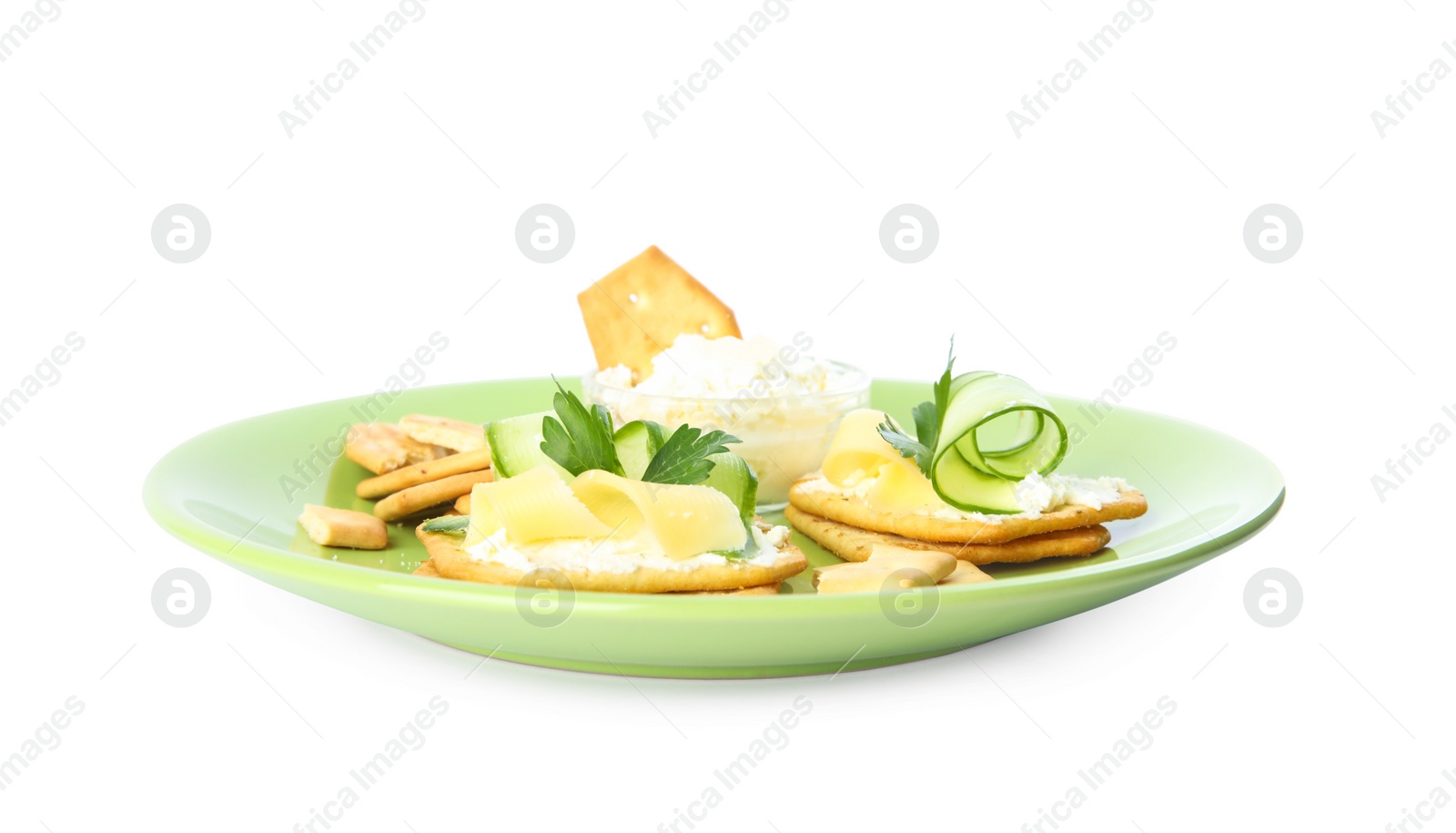 Photo of Delicious crackers with cream cheese, cucumber and parsley on white background