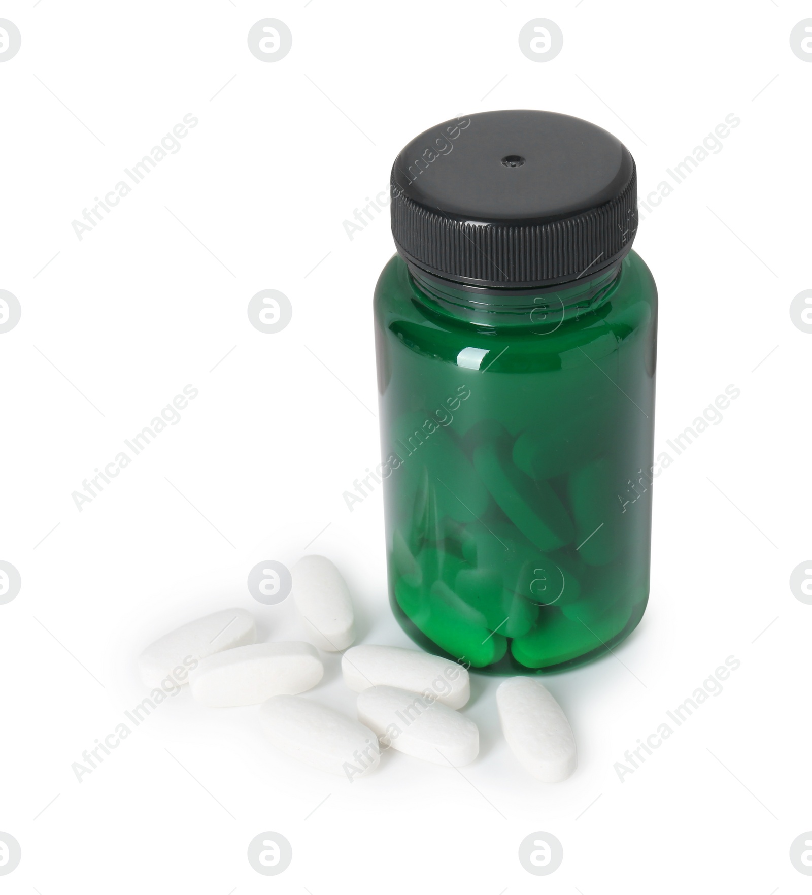 Photo of Bottle and pile of vitamin pills isolated on white