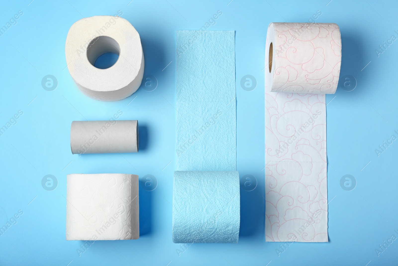 Photo of Flat lay composition with toilet paper on color background