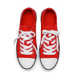Photo of Pair of red classic old school sneakers isolated on white, top view
