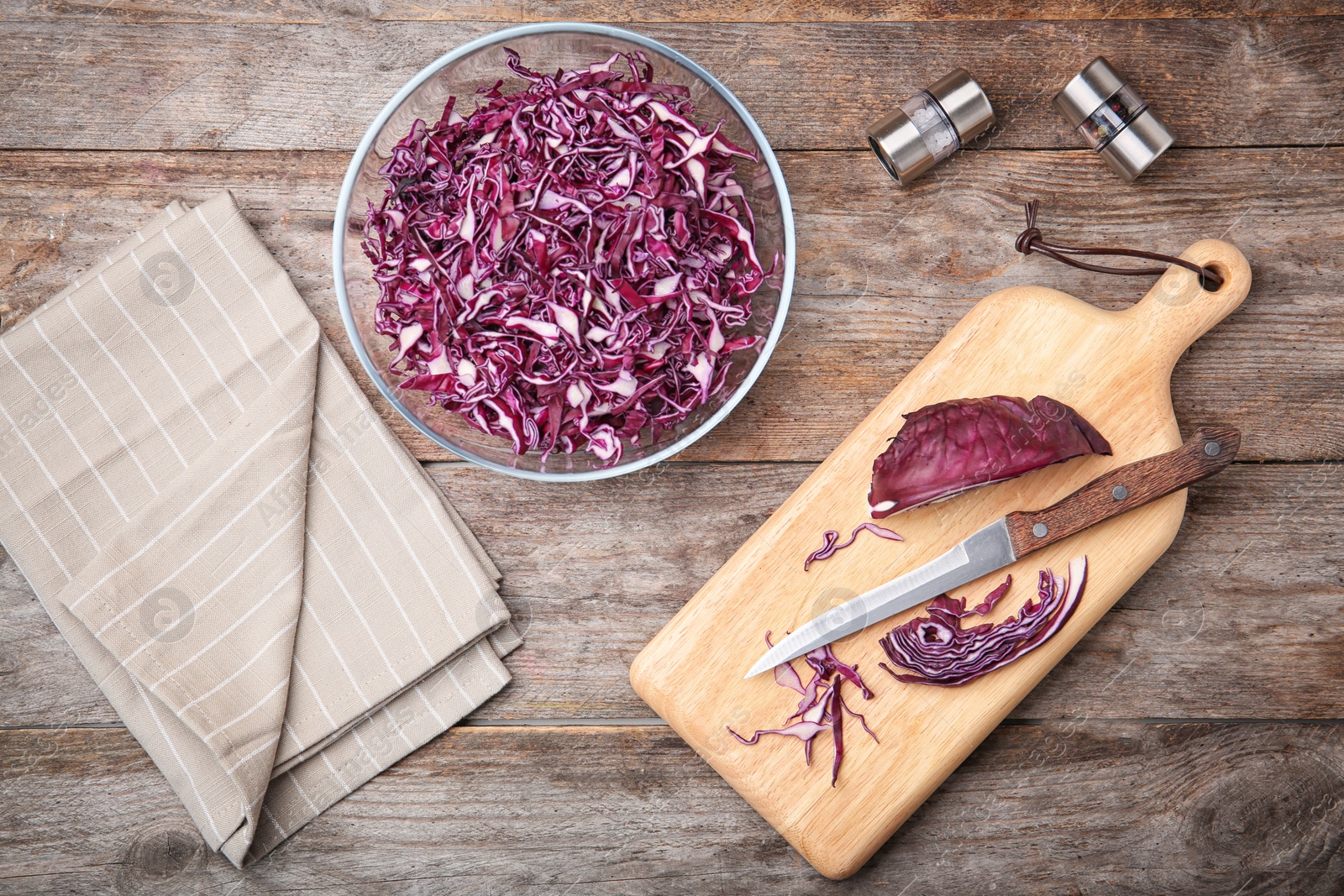 Photo of Flat lay composition with chopped purple cabbage on wooden background