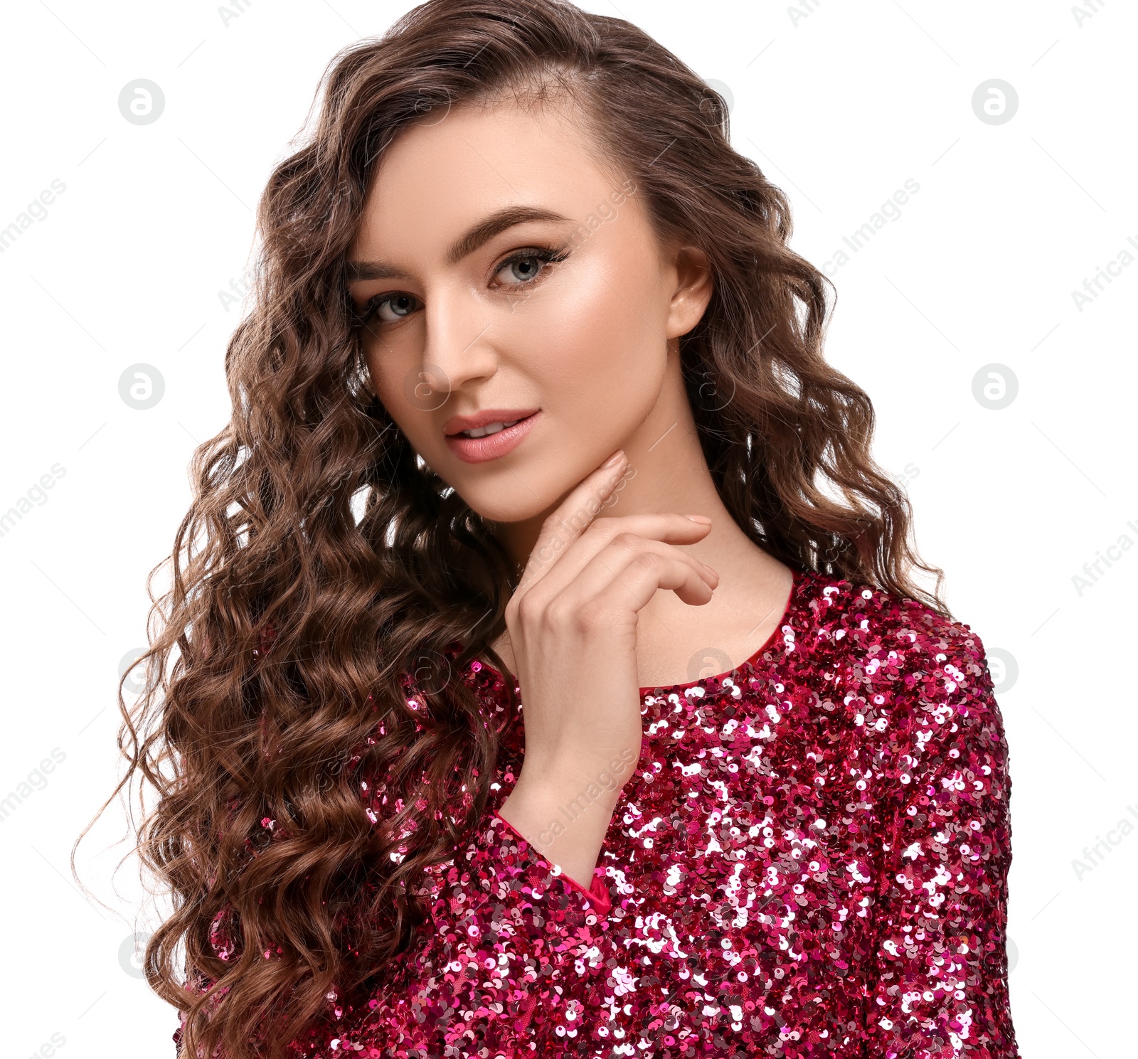 Photo of Beautiful young woman with long curly brown hair in pink sequin dress on white background