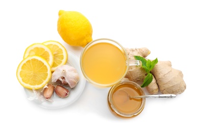 Cup with hot tea and other cold remedies on white background