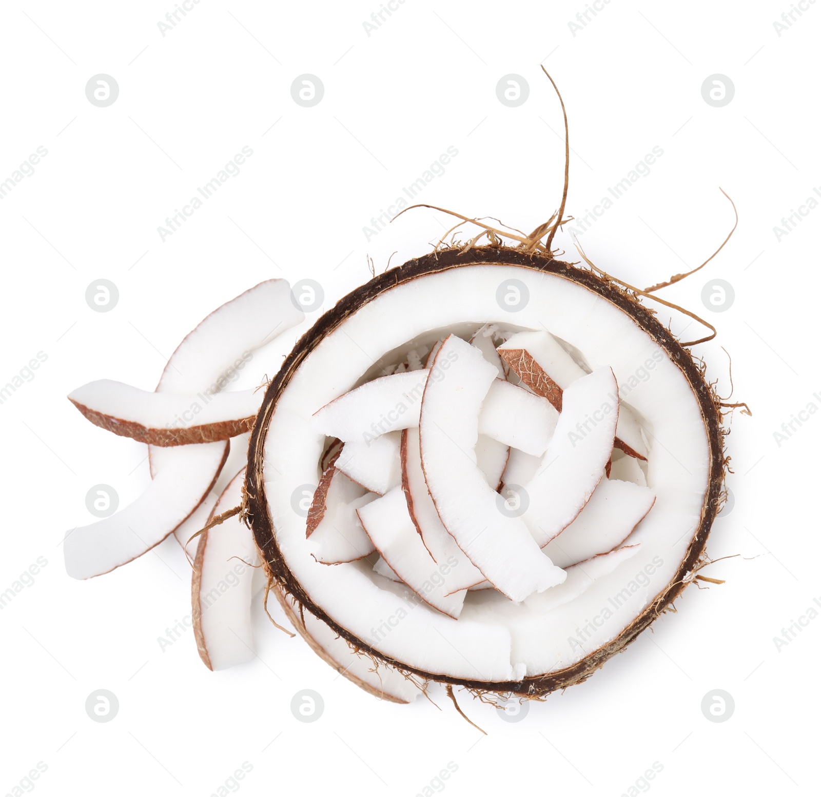 Photo of Coconut pieces in nut shell isolated on white, top view