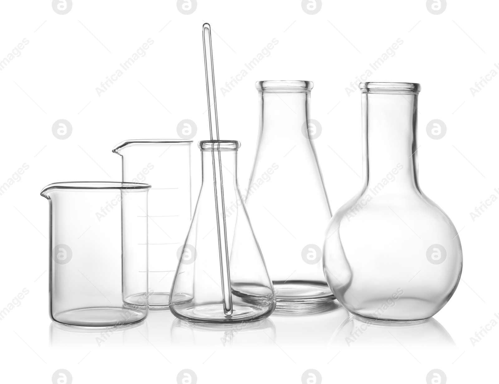 Photo of Clean empty laboratory glassware on white background