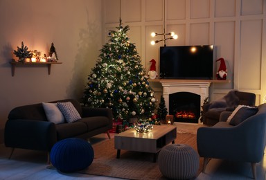 Photo of Cozy living room interior with beautiful Christmas tree near fireplace