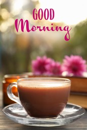 Good morning! Glass cup with coffee on wooden table