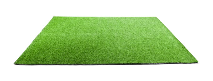 Photo of Green artificial grass carpet isolated on white