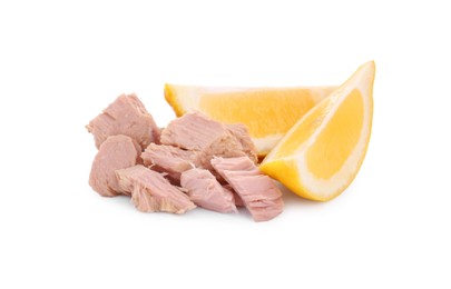 Photo of Delicious canned tuna chunks with lemon isolated on white