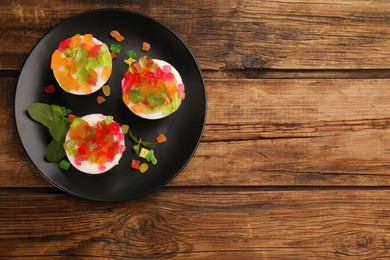 Delicious broken glass jelly dessert on wooden table, top view. Space for text