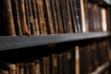 Photo of Blurred view of different books on shelves in library