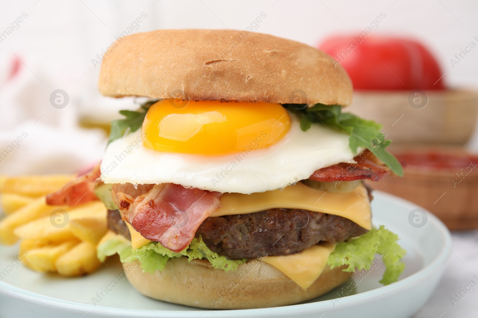 Photo of Delicious burger with fried egg served on table, closeup