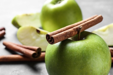 Photo of Fresh apple and cinnamon stick, closeup