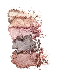 Photo of Crushed eye shadows on white background, top view. Professional makeup product