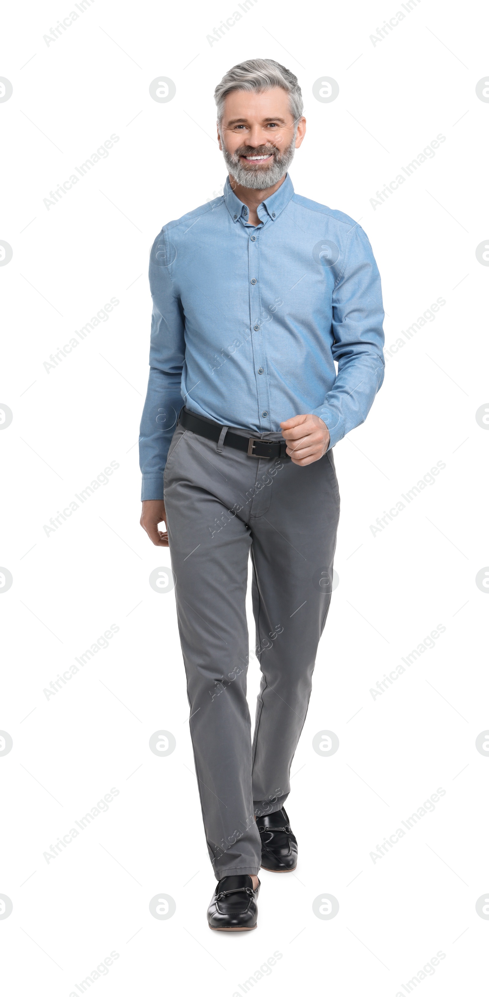 Photo of Mature businessman in stylish clothes posing on white background