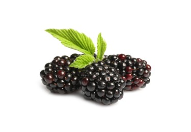 Photo of Tasty ripe blackberries and green leaves isolated on white