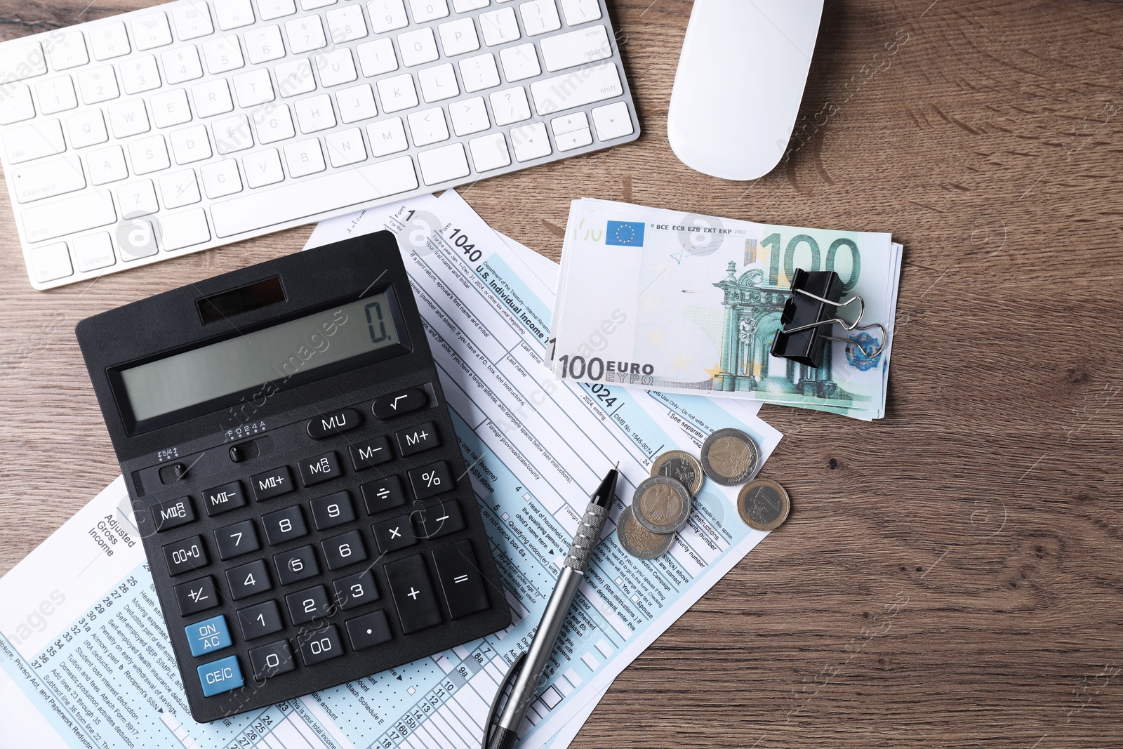 Photo of Tax accounting. Flat lay composition with calculator and documents on wooden table