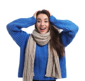 Photo of Young woman wearing warm clothes on white background. Winter season