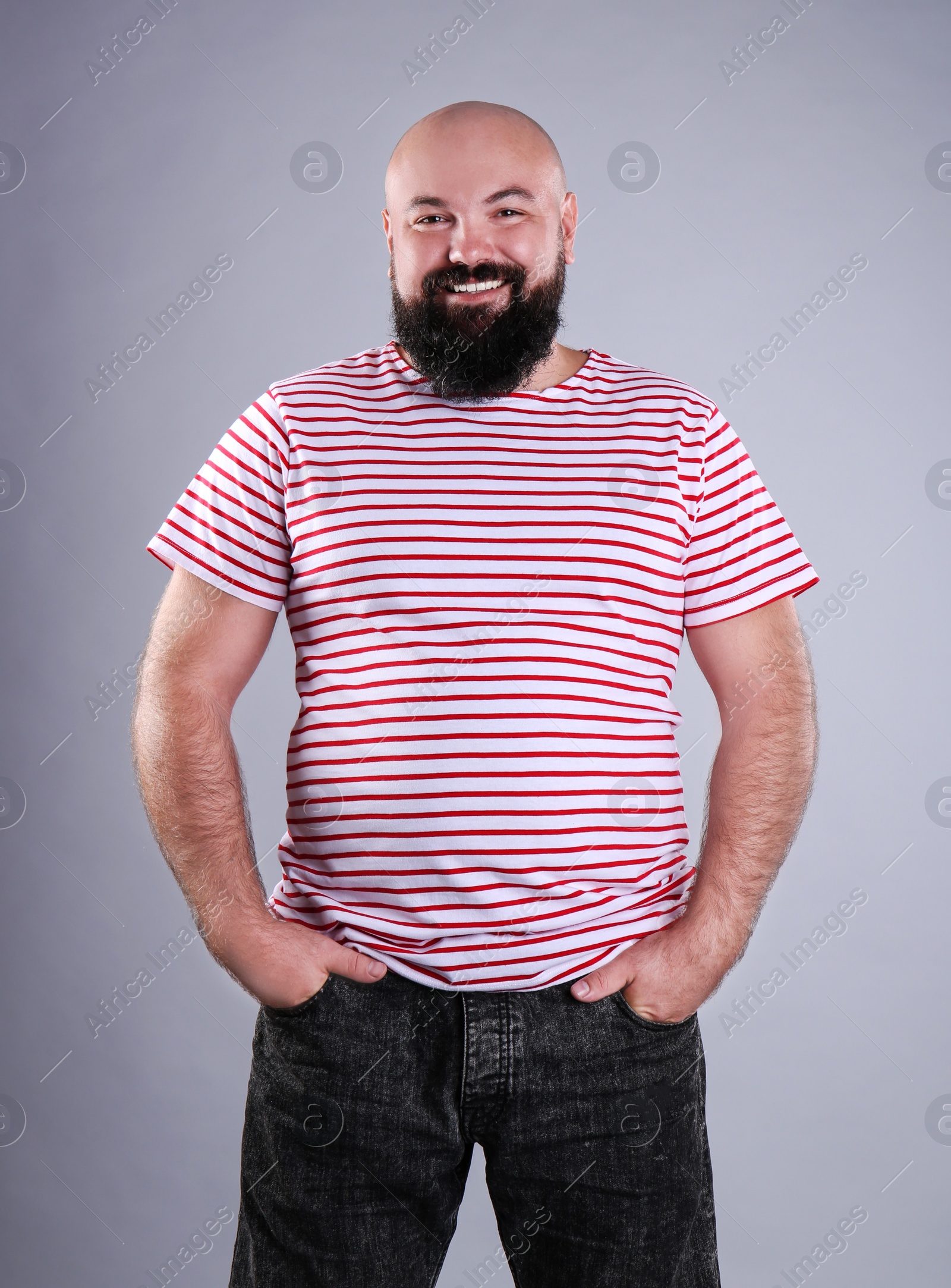 Photo of Fat man on grey background. Weight loss