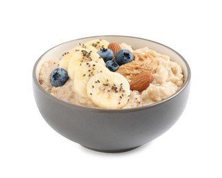 Photo of Tasty oatmeal porridge with different toppings in bowl on white background