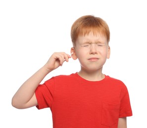 Little boy cleaning ear with cotton swab on white background