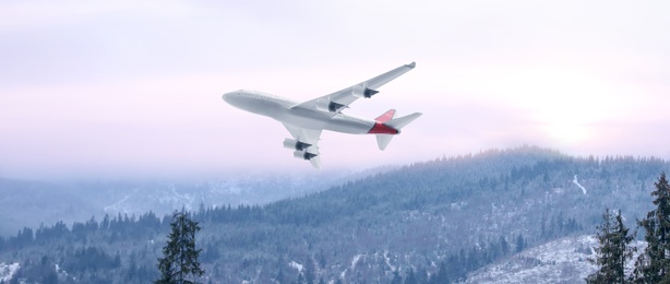 Modern airplane flying over mountains, banner design 