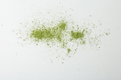 Photo of Powdered matcha tea on white background, top view
