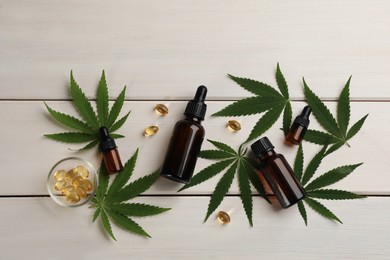 Photo of Flat lay composition with hemp leaves, CBD oil and THC tincture on white wooden table