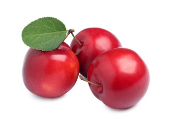 Photo of Delicious ripe cherry plums with leaf on white background