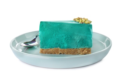 Photo of Piece of delicious spirulina cheesecake isolated on white