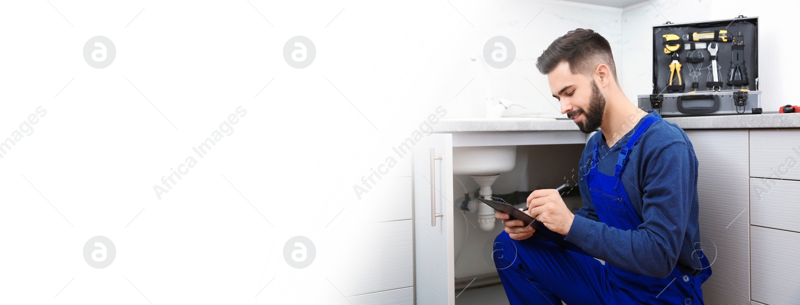 Image of Male plumber with clipboard near kitchen sink, space for text. Banner design