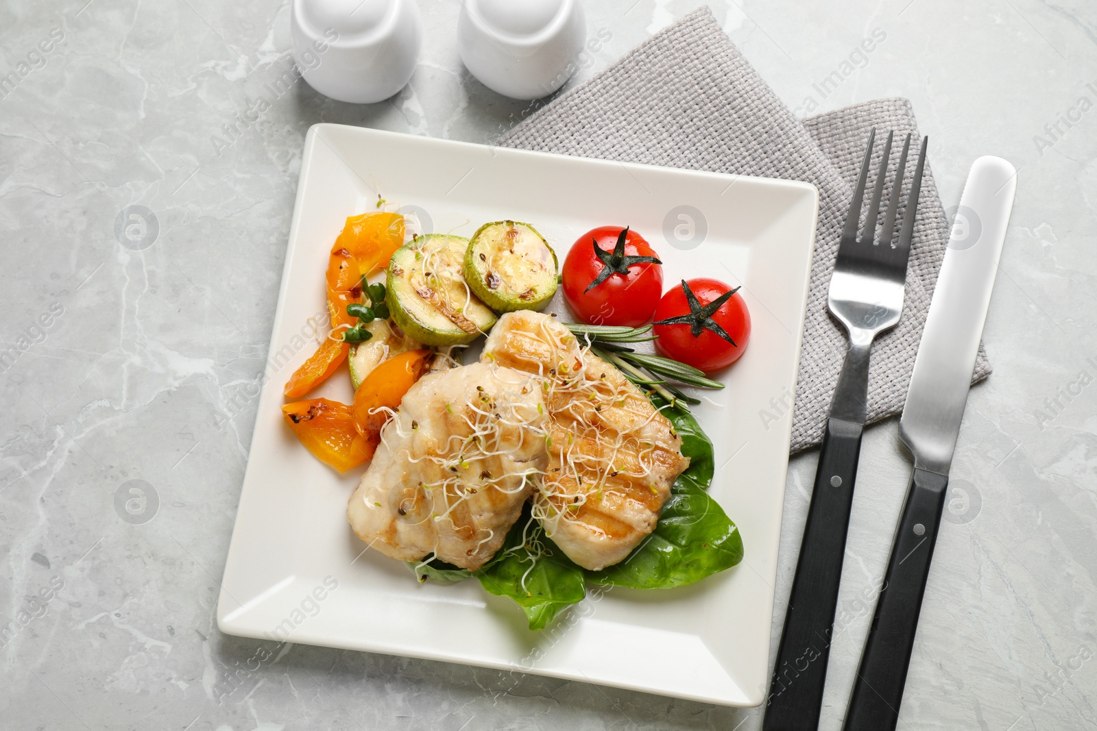 Photo of Flat lay composition with grilled fish on light grey marble table